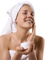 woman using face cream