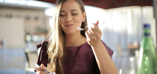 woman in purple eating