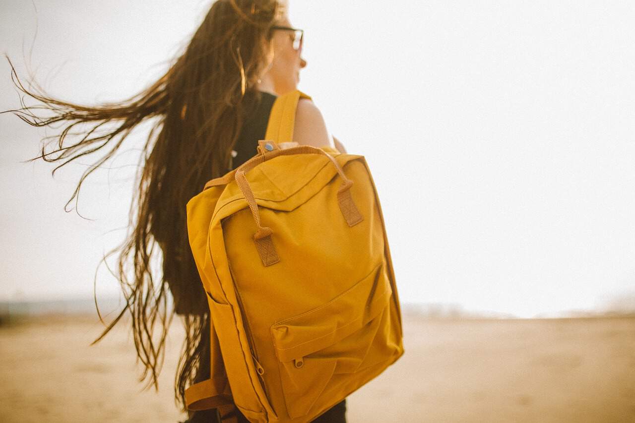 yellow bag travel girl