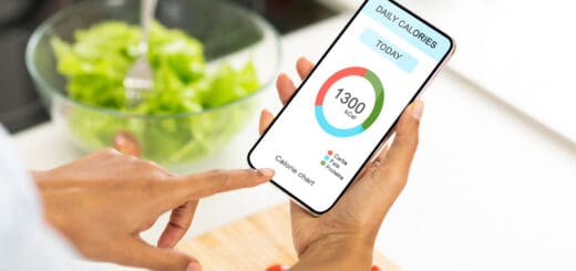 Dieting Concept. Unrecognizable woman eating vegetable salad and counting daily calories with app on smartphone, checking calorie chart in mobile application, creative collage for weightloss, closeup